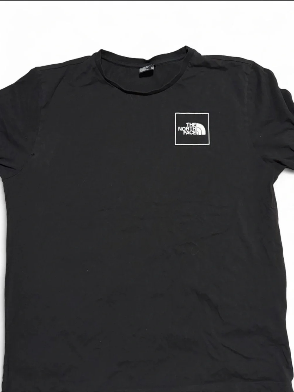 The North Face Black Short-Sleeve Graphic Tee with Red & Blue Accents
